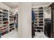 Spacious walk-in closet featuring custom shelving for ample storage and organization at 13462 Panama Beach Ct, Orlando, FL 32827