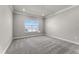 Bedroom filled with natural light from a large window creating an inviting ambiance at 13758 Tybee Beach Ln, Orlando, FL 32827