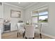 Cozy breakfast nook features a glass top table, comfortable chairs, and a view of the outdoors at 13758 Tybee Beach Ln, Orlando, FL 32827