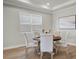 Dining room with recessed lights, large window with blinds, and a neutral color scheme at 13758 Tybee Beach Ln, Orlando, FL 32827