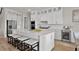 Bright kitchen featuring a center island with seating, stainless appliances, and lots of storage space at 13758 Tybee Beach Ln, Orlando, FL 32827