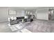 Cozy living room featuring plush carpeting, comfortable seating, and ample natural light at 13758 Tybee Beach Ln, Orlando, FL 32827