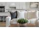 Comfortable seating in a living room showcasing open concept with kitchen and eat-in dining area at 13758 Tybee Beach Ln, Orlando, FL 32827