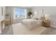 Staged bedroom featuring neutral tones, natural light, and stylish decor at 13758 Tybee Beach Ln, Orlando, FL 32827