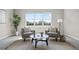 Seating area in main bedroom with natural light from large windows, and plush carpet at 13758 Tybee Beach Ln, Orlando, FL 32827