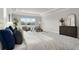 Main bedroom with tray ceiling and seating area with bright natural light at 13758 Tybee Beach Ln, Orlando, FL 32827
