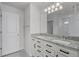 Bright bathroom with granite counters and double sinks at 14538 Orchid Island Dr, Orlando, FL 32827