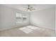 Well-lit bedroom with neutral carpet and ceiling fan at 14538 Orchid Island Dr, Orlando, FL 32827