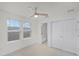 Bright bedroom featuring neutral carpet, ceiling fan, and closet at 14538 Orchid Island Dr, Orlando, FL 32827