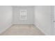 Clean, carpeted bedroom with a window at 14538 Orchid Island Dr, Orlando, FL 32827