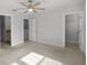 Spacious bedroom with ceiling fan and natural light at 14538 Orchid Island Dr, Orlando, FL 32827