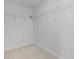 Walk-in closet with built-in shelving at 14538 Orchid Island Dr, Orlando, FL 32827