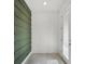 Bright entryway with a textured green accent wall and tile flooring at 14538 Orchid Island Dr, Orlando, FL 32827
