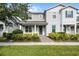 Charming two-story home featuring a well-manicured lawn and inviting front porch at 14538 Orchid Island Dr, Orlando, FL 32827