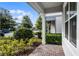 View of the well-kept landscaping and inviting front porch of a home at 14538 Orchid Island Dr, Orlando, FL 32827