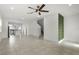 Open-concept living space with stairs and a view of the modern kitchen at 14538 Orchid Island Dr, Orlando, FL 32827