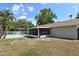 Exterior view of a screen lanai looking onto the backyard and pool at 1515 Pelican St, Longwood, FL 32750