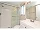 Bathroom with a tiled walk-in shower and a bright vanity with modern fixtures at 1515 Pelican St, Longwood, FL 32750