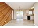 Open dining area features stylish flooring and natural light from the sliding doors at 1515 Pelican St, Longwood, FL 32750