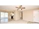 Spacious living room featuring neutral paint, ceiling fan, carpeted and wood flooring at 1515 Pelican St, Longwood, FL 32750
