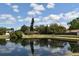 Scenic view of the pond and surrounding neighborhood from across the water at 1515 Pelican St, Longwood, FL 32750