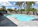 Backyard swimming pool surrounded by lush tropical landscaping and a wood fence at 1515 Pelican St, Longwood, FL 32750