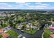 Aerial view of a waterfront community showcasing beautiful homes with private docks and access to the water at 1620 Texas Ct, Tavares, FL 32778