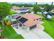 This gorgeous waterfront property boasts solar panels, boat dock and trailer, plus lush lawn at 1620 Texas Ct, Tavares, FL 32778