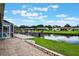 Expansive backyard featuring a waterfront canal, dock, and lush greenery at 1620 Texas Ct, Tavares, FL 32778