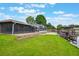 Lovely backyard with a screened-in pool, canal access, and boat lift for water enthusiasts at 1620 Texas Ct, Tavares, FL 32778