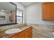 Bathroom with granite countertops, ample cabinet space, and modern fixtures at 1620 Texas Ct, Tavares, FL 32778