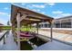 Covered boat dock with a red motorboat and access to the waterfront property at 1620 Texas Ct, Tavares, FL 32778