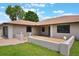 Charming front exterior showcasing a well-maintained lawn and inviting entrance, enhancing curb appeal at 1620 Texas Ct, Tavares, FL 32778