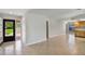 The spacious foyer features neutral tiling and light walls, complemented by natural lighting at 1620 Texas Ct, Tavares, FL 32778