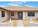 Close up of the front entrance featuring a well-kept walkway and decorative lighting at 1620 Texas Ct, Tavares, FL 32778