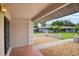 View from the front porch showing the walkway and well-maintained landscaping at 1620 Texas Ct, Tavares, FL 32778