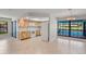 Open kitchen and dining area with appliances and tile flooring at 1620 Texas Ct, Tavares, FL 32778