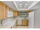 Kitchen view showing sink, faucet, and window with pool view at 1620 Texas Ct, Tavares, FL 32778