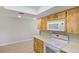 Kitchen area featuring built in microwave and white appliances at 1620 Texas Ct, Tavares, FL 32778