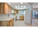 Kitchen featuring white appliances and a skylight at 1620 Texas Ct, Tavares, FL 32778