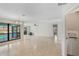 Bright living room with tile floors, ceiling fan and a view of the pool at 1620 Texas Ct, Tavares, FL 32778