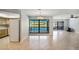 Bright living room with tile floors and views of the pool at 1620 Texas Ct, Tavares, FL 32778
