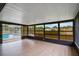 Enclosed lanai with vinyl floors overlooking the pool at 1620 Texas Ct, Tavares, FL 32778