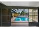 View of the screened-in outdoor pool and patio, perfect for entertaining at 1620 Texas Ct, Tavares, FL 32778