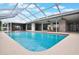 Bright screened-in pool with outdoor dining area, offering a delightful space for leisure at 1620 Texas Ct, Tavares, FL 32778