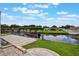 View of the waterfront canal with covered boat dock from the patio at 1620 Texas Ct, Tavares, FL 32778