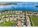 Stunning aerial view of waterfront homes, showing proximity to the lake and community amenities at 16696 Otterchase Ln, Winter Garden, FL 34787