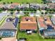 Beautiful aerial view of a well-manicured neighborhood showcasing the tile roofs and lush landscaping at 16696 Otterchase Ln, Winter Garden, FL 34787