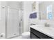 Bathroom featuring glass shower, toilet, and vanity with stone countertop at 16696 Otterchase Ln, Winter Garden, FL 34787