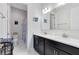 Contemporary bathroom with dual sink vanity, shower, and toilet at 16696 Otterchase Ln, Winter Garden, FL 34787